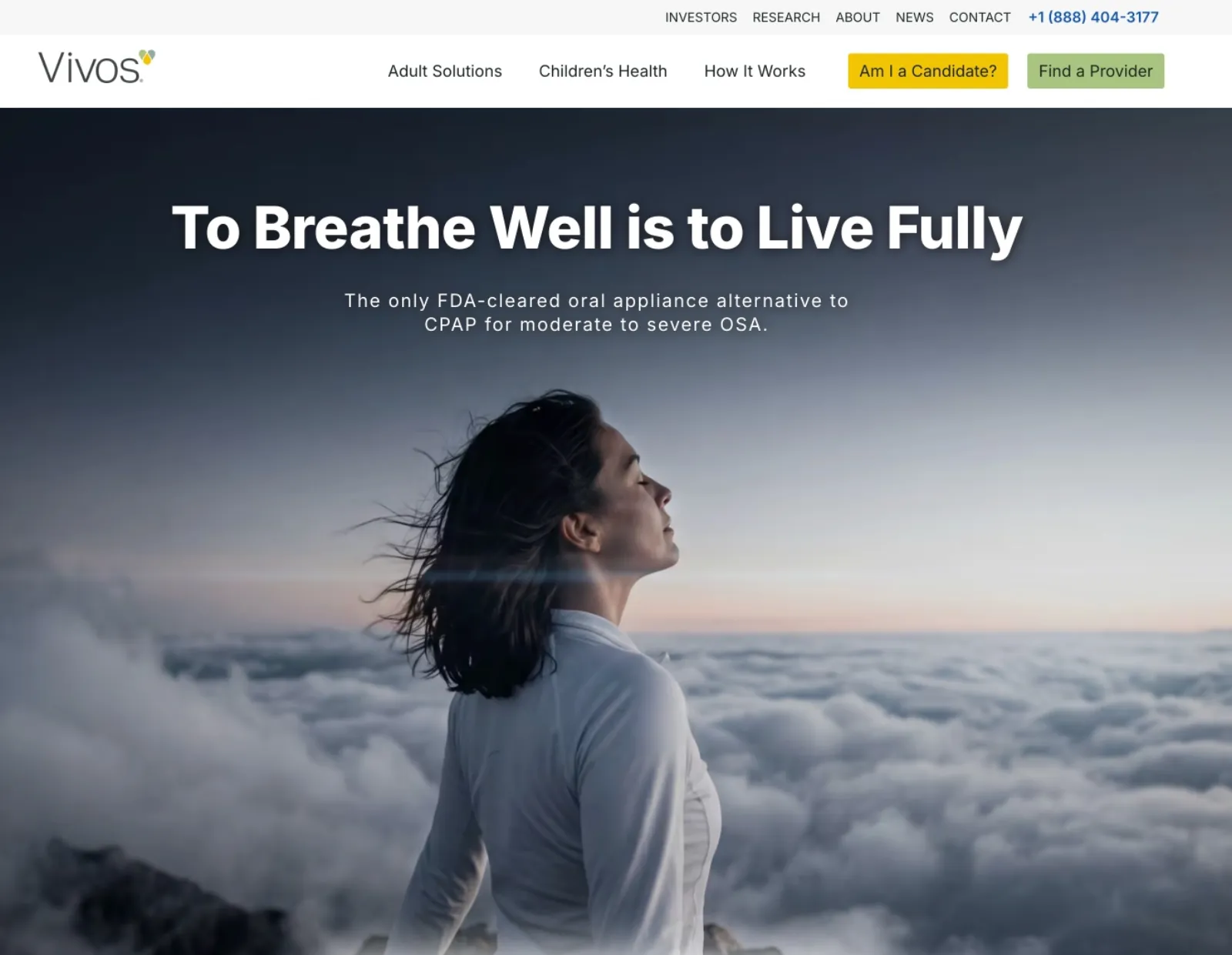 Vivos Therapeutics website homepage showing a woman looking upward above a cloud layer, with the headline "To Breathe Well is to Live Fully"
